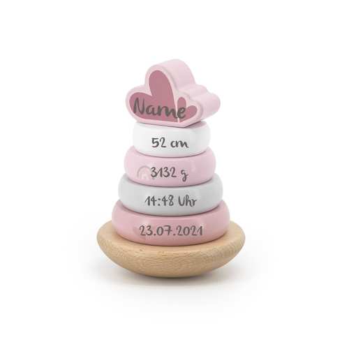 Stapelturm aus Holz in rosa